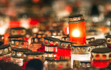 Latvian patriots lighting candles as a tribute to fallen freedom fighters. Hundreds of lighten up candles creating cosy atmosphere. Lāčplēša diena - day of independence of Latvia. 