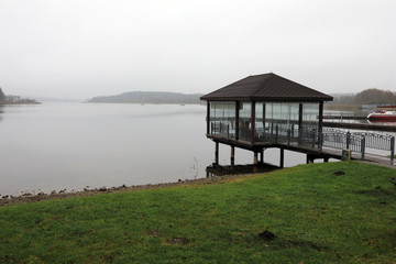 Gazebo on bank of lake in morning