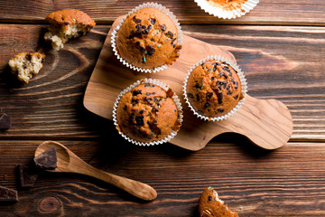 Obraz na płótnie Canvas Delicious homemade muffins on wood.