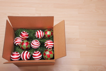 Christmas ornaments stored in a cardboard box