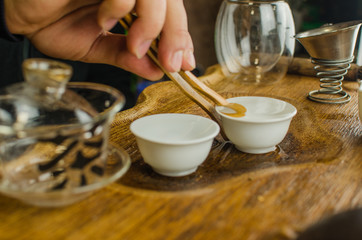 Chinese tea ceremony with Anchnag on wooden background