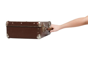 Retro suitcase and female hands isolated on the white background.