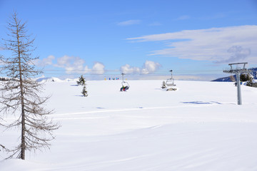 skilifts in the Alps on a sunny winter day