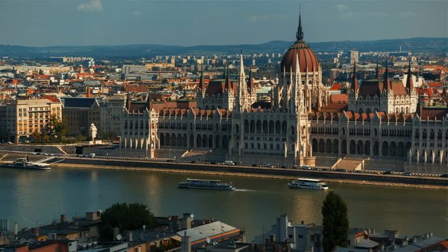 Medium panning shot of the Parliament and Chain Bridge in the Hungarian city of Budapest named after the Scottish civil engineer