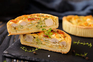 Meat mini pie on the wooden board on table background, closeup with copy space, rustic style