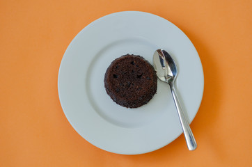 Hot Chocolate Cake Souffle on orange background.