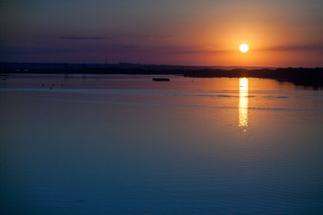 Fototapeta na wymiar Sunset on the river