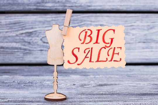 Wooden Mannequin And Card With Inscription Big Sale. Wooden Dummy Mannequin Cutout With Attached Message Big Sale.