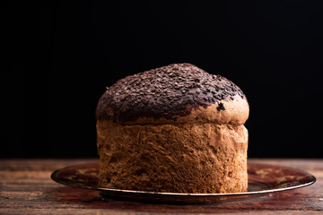Choccolate panettone on a rustic table