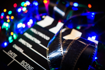 Fototapeta na wymiar Movie film unrolled on Christmas light