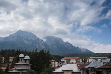 Fototapeta na wymiar Landscape of small city on background of Carpathians Mountains
