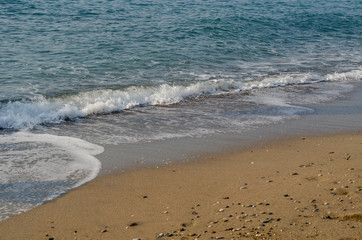 Waves on a sandy beach.  Background for web pages and printing.