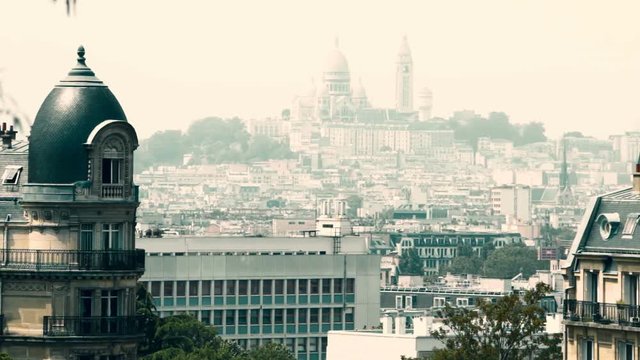 Skyline of Paris. A view from Parc des Buttes Chaumont on Basilica of the Sacre Coeur