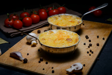 julienne with mushrooms on a wooden background