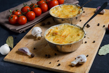 julienne with mushrooms on a wooden background