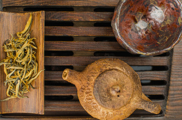 Chinese tea ceremony with Anchnag on wooden background