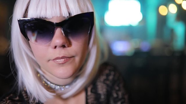 Sexy unusual blonde girl with eyewear in a bar