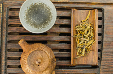 Chinese tea ceremony with Anchnag on wooden background