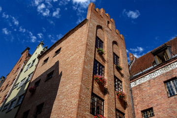 Fototapeta na wymiar Building architecture close up on famous Swietego Ducha street in Main Town of Gdansk, Poland