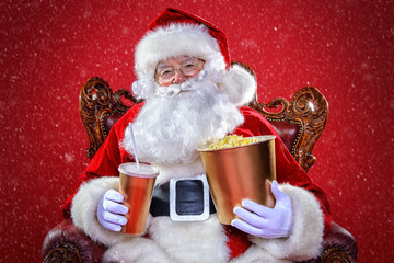 Fototapeta premium santa claus is watching a movie
