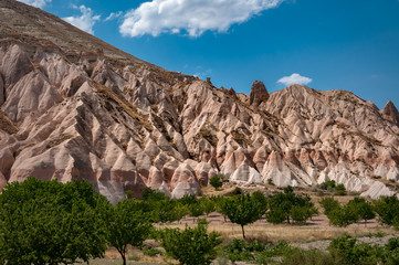 Fototapeta premium View from the structure of Cappadocia. Impressive fairy chimneys of sandstone in the canyon near Cavusin village, Cappadocia, Nevsehir Province in the Central Anatolia Region of Turkey. Overcast sky.