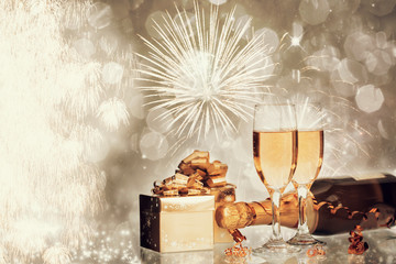 Glasses of champagne on holiday background