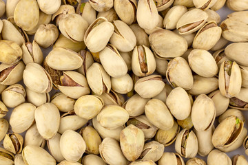 Nuts pistachios are not cleaned. Background, texture.