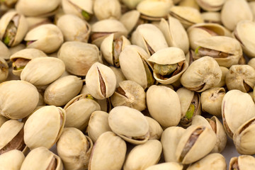 Nuts pistachios are not cleaned. Background, texture.