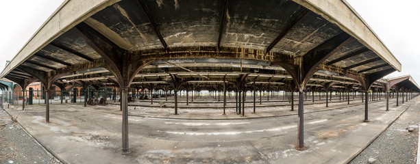 Fototapeta na wymiar Derelict railway platforms in the historic Bush Train Shed located next to the Central Railroad of New Jersey Terminal