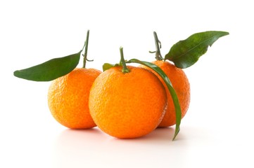 tangerines with leaves isolated on white
