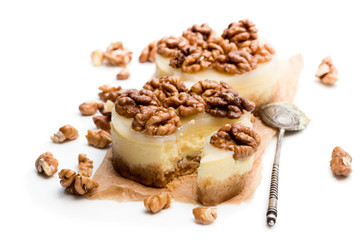 Two mini walnut cheesecake isolated on white