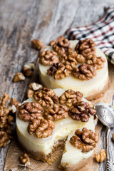 Fototapeta na wymiar Two mini walnut cheesecake on wooden table