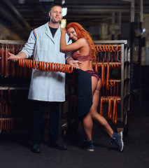 Butcher and his sexy girl assistant in the storage room.