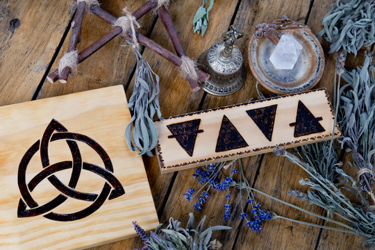 The Elements - Earth, Fire, Water, Air and Triquetra symbols - with brass bell, quartz crystal, branch pentagram