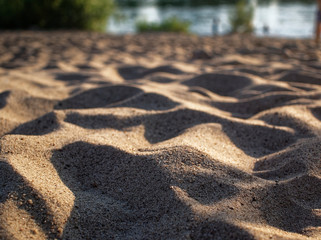 river sand on the shore in summer