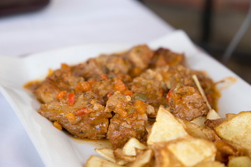 Magro con pisto pork meat with vegetables sauce from Andalusia