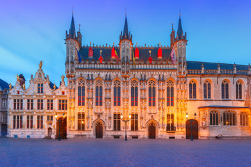 Fototapeta premium Scenic cityscape with the picturesque night medieval Christmas Burg Square in Bruges, Belgium