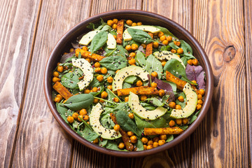 Baby spinach salad with sweet potato , chickpeas and avocado