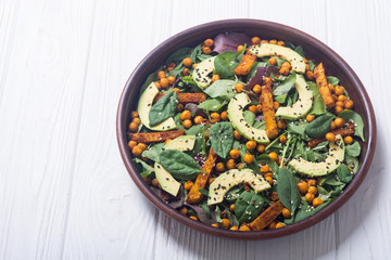 Baby spinach salad with sweet potato , chickpeas and avocado
