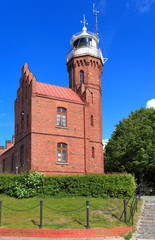 Ustka, Pomerania, Poland - Historic lighthouse building at the Baltic Sea shoreline and Slupia...