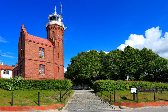 Ustka, Pomerania, Poland - Historic lighthouse building at the Baltic Sea shoreline and Slupia river in Ustka