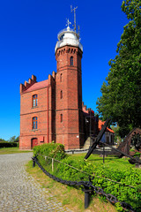 Ustka, Pomerania, Poland - Historic lighthouse building at the Baltic Sea shoreline and Slupia river in Ustka © Art Media Factory