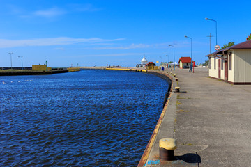 Ustka, Pomerania, Poland - Ustka seaport peers and ships and the Baltic Sea shoreline © Art Media Factory