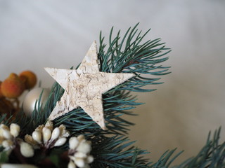 wooden sar on a small christmas branch