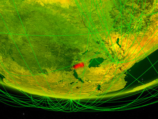 Rwanda on green model of planet Earth with network representing digital age, travel and communication.