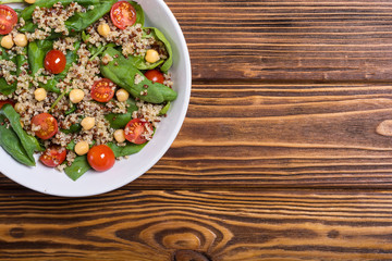 Spinach salad with quinoa , tomatoes and chickpea