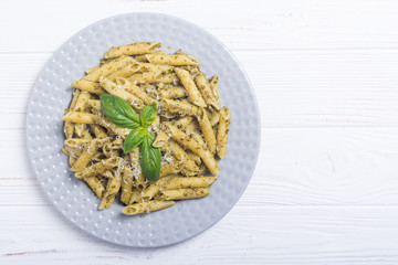 Italian penne pasta with sauce pesto