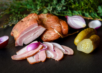 Smoked bacon with cucumber, onion, herbs and juniper