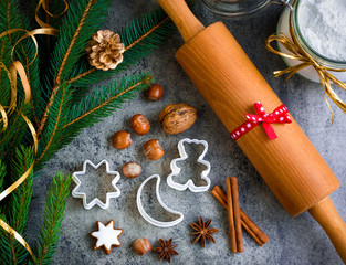 Christmas gingerbread with decoration on a wooden board. Top view, flatlay