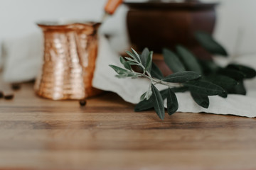 Olive branches on a wooden rustic background